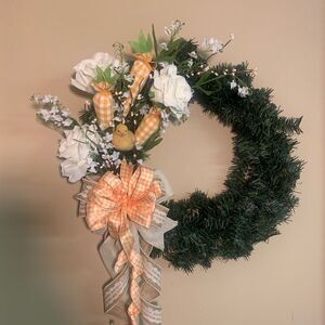 Festive Green and White Holiday Wreath with Orange Accents